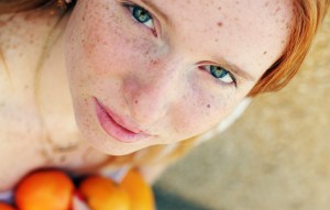 Closeup portrait of beautiful young redhead girl